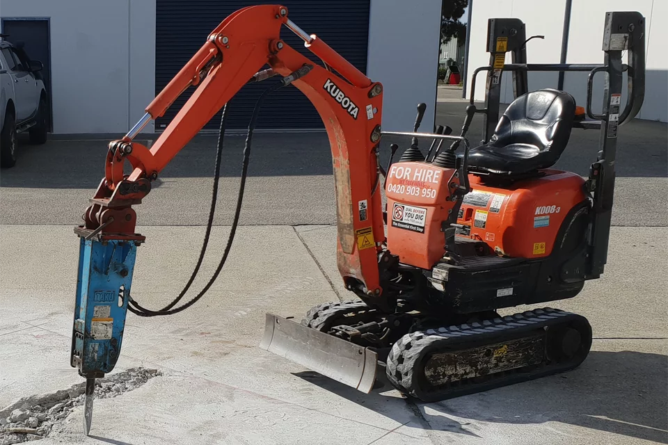 Mini excavator with rock breaker attachment